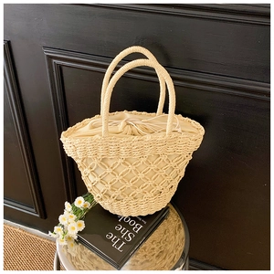 Detail showing the intricate hollow diamond weave pattern and inner drawstring pouch