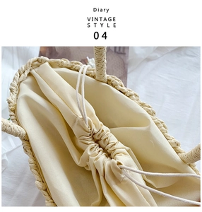 Detail of straw woven bag with beige drawstring inner lining and vintage handmade texture