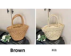 Hollow straw shoulder bag in brown and off-white colors with drawstring liner detail