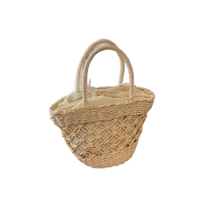 Elegant beige straw handbag with woven hollow pattern and drawstring inner pouch for women