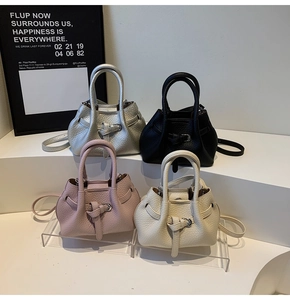 Litchi pattern bucket bags displayed in silver, black, rose pink, and cream colors