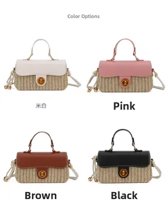 Detail of hand-woven straw bags in cream, pink, brown, and black with leather straps