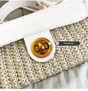 Close-up of golden rotating metal buckle and textured woven fabric on hand-held square bag