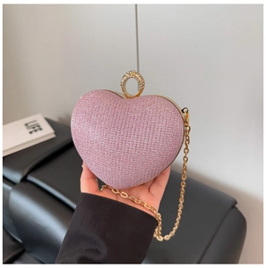 Pochette de soirée rose en forme de cœur avec paillettes et poignée en diamants