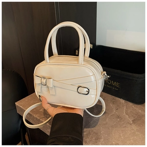 Minimalist beige glossy crossbody bag with decorative bow and buckle for women