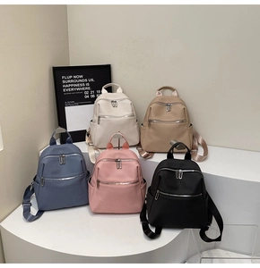 Five colors of minimalist waterproof nylon mini backpacks with smooth silver metal zippers