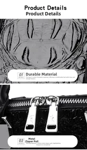 Detailansicht der schwarzen Kroko-Lederstruktur und der silbernen Metallreißverschlüsse