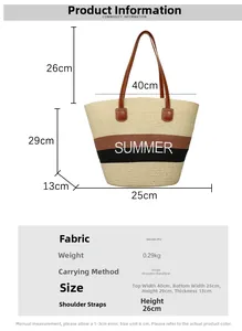 Detail of summer straw tote bag featuring white Summer embroidery and brown PU handles