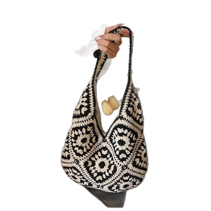 Handmade crochet flower shoulder bag in black and white bohemian style pattern