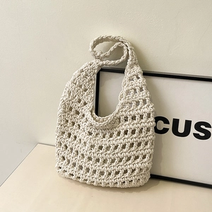 Minimalist cream woven tote bag with hollow mesh pattern in a modern Nordic setting