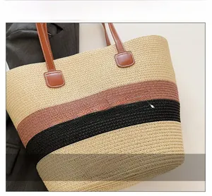 Detail of tricolor woven tote bag with SUMMER embroidery and premium leather straps