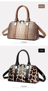 Detailansicht von Khaki-Krokodilleder und Leopardenmuster Boston Taschen mit Griffen