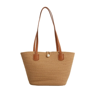 Minimalist woven tote bag with large pearl buckle and brown leather shoulder straps