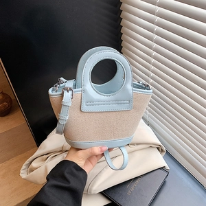 Blue and beige woven handbag with top handle and adjustable shoulder strap for women