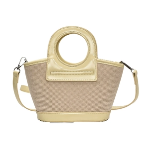 Minimalist cream woven trapezoid handbag with circular cutout handles and crossbody strap