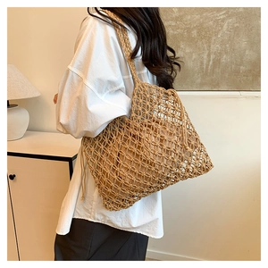 Close-up of woven shoulder bag with mesh hollow texture and cotton drawstring liner
