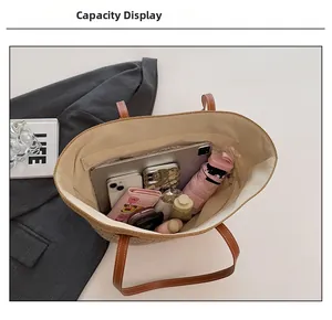 Macro view of straw tote interior showing spacious capacity for tablets and essentials