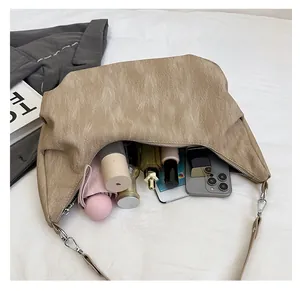 Interior view showing the large capacity for essentials in this soft leather hobo bag
