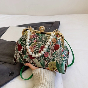 Floral jacquard handbag with pearl handle and gold clasp for evening occasions