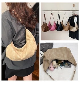Detail view of large capacity vintage soft leather crescent bag and daily item storage