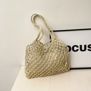 Minimalist beige woven shoulder bag with mesh design and drawstring canvas inner pouch
