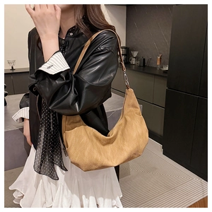 Detailed view of the hobo bag with soft pleated texture and adjustable shoulder strap
