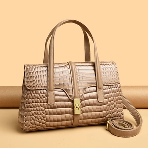 Khaki crocodile pattern tote bag with gold twist lock and adjustable shoulder strap