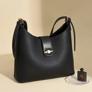 Large black lychee pattern leather bucket bag with gold buckle and adjustable strap