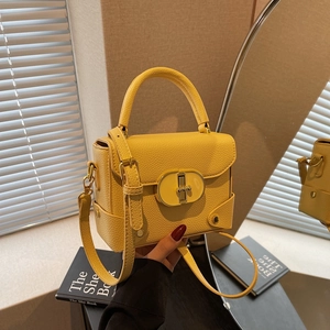 Elegant bright yellow crossbody bag with gold hardware and stylish lychee texture leather