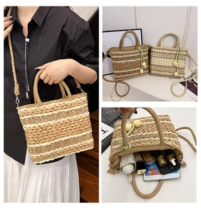 Detail of straw woven crossbody bag with tulip charm and interior storage capacity