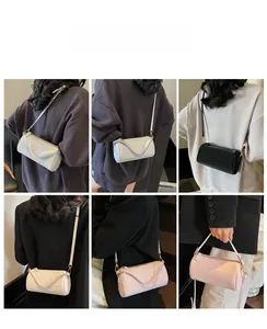 Detailed views of leather barrel bag in white black and pink showing multi-way wear