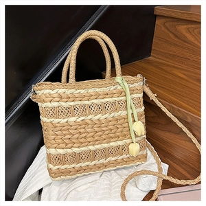 Detailed wave-pattern straw bag texture with tulip charms and green ribbon