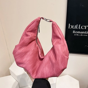 Pink soft leather hobo bag with dumpling shape and silver ring handle for daily commute