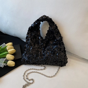 Sparkly black sequin hobo evening bag with silver chain strap and shiny triangular shape