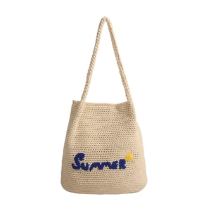 Large beige woven straw tote bag with Summer embroidery and yellow flower for vacation