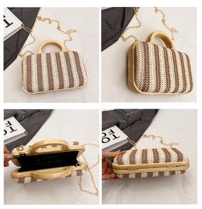 Detail view of woven striped handbag with round wooden handles and golden chain strap