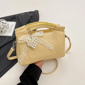 Chic cream yellow crossbody bag with pearl heart charm and lace bow decoration