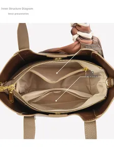 Internal view of brown leather bucket bag showing organized lining and silk scarf handle
