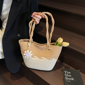 Chic woven tote bag with two-tone color block and twisted rope handles for travel