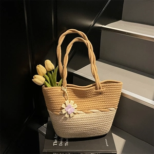 Woven tote bag with sunflower charm and cotton rope stitching for beach holidays