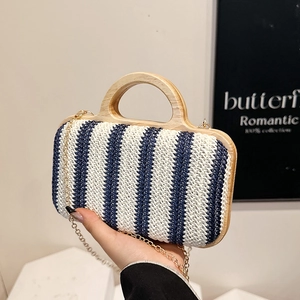 Handwoven blue striped straw bag with wooden handles and gold chain strap for beach