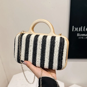 Handcrafted black and white striped straw bag with wooden handles and gold chain