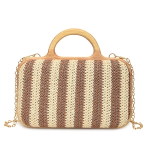 Handmade striped straw handbag with round wooden handles and gold chain for beach vacation