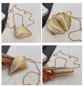 Macro views of shell-shaped gold acrylic evening bag showing texture, lining, and chain
