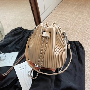 Fashionable beige pleated bucket bag with silver chain and shoulder strap for daily casual style