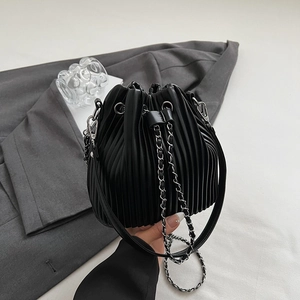 Chic black pleated bucket bag with silver chain strap and drawstring closure for women