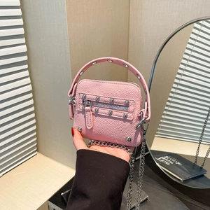 Pink rivet motorcycle mini bag with silver chain strap and lychee leather texture