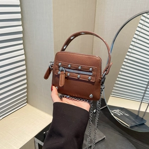 Brown lychee leather handbag with silver rivets and metal chain strap for women