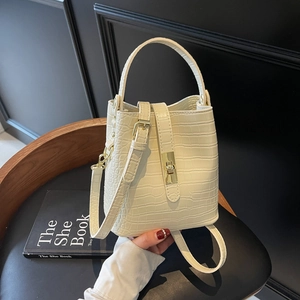 Chic cream crocodile pattern bucket bag with golden metal lock for commute