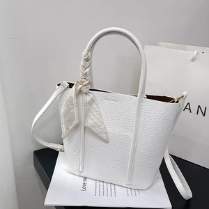 White lychee leather tote bag with a decorative floral scarf and shoulder strap